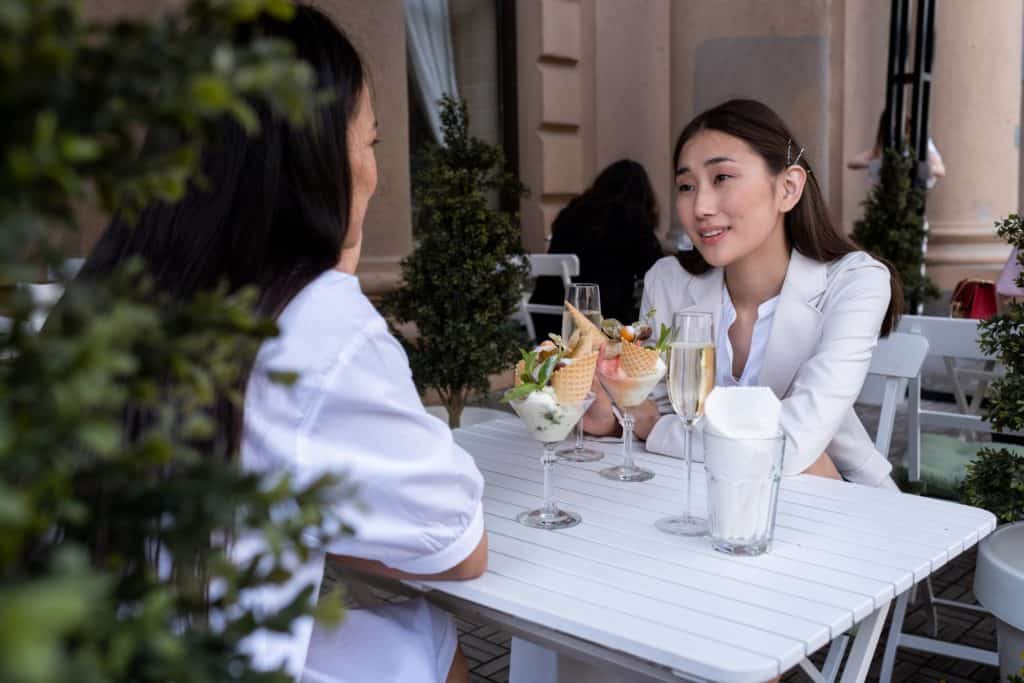 a photo of two ladies having lunch