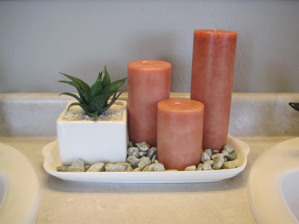 a photo of candles in an accessories tray