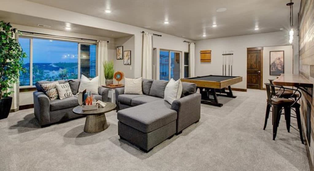 a photo of a basement with a pool table