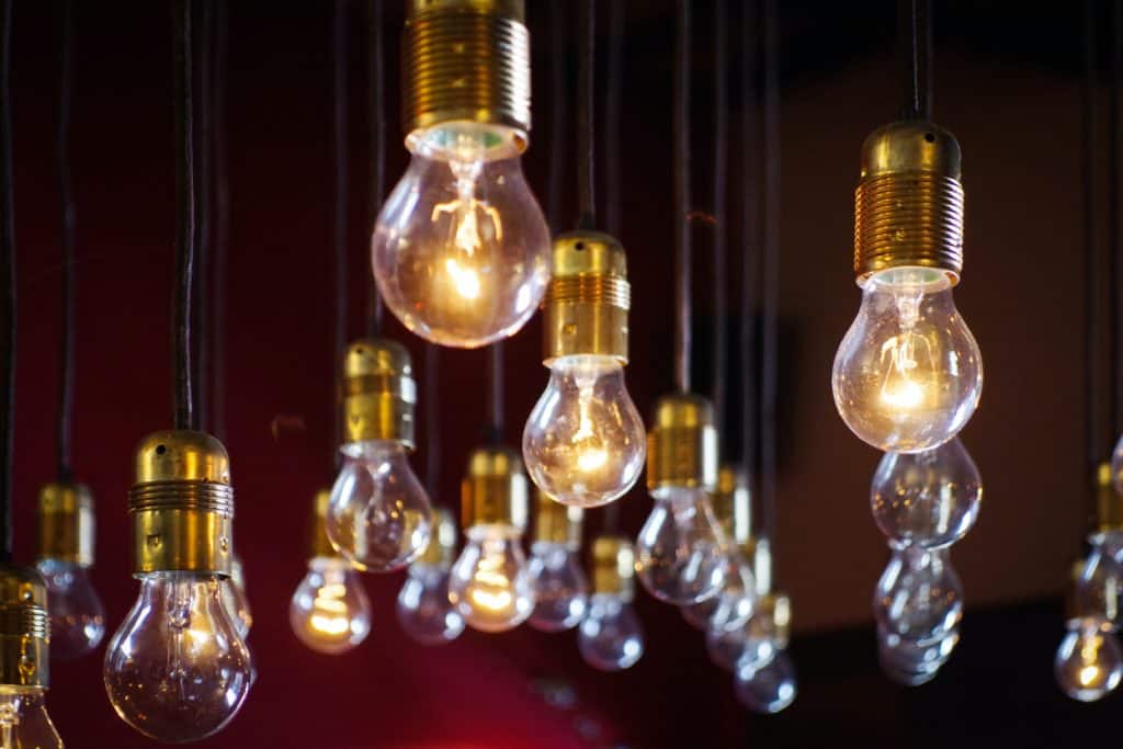 a photo of brass lightbulbs hanging from the ceiling