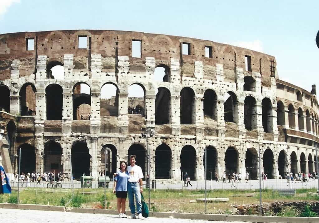 A photo of a couple outside the Roman Colosseum