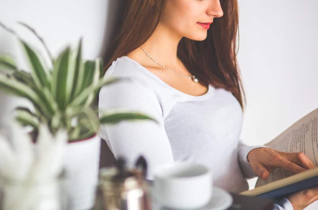 a photo of a girl reading a book