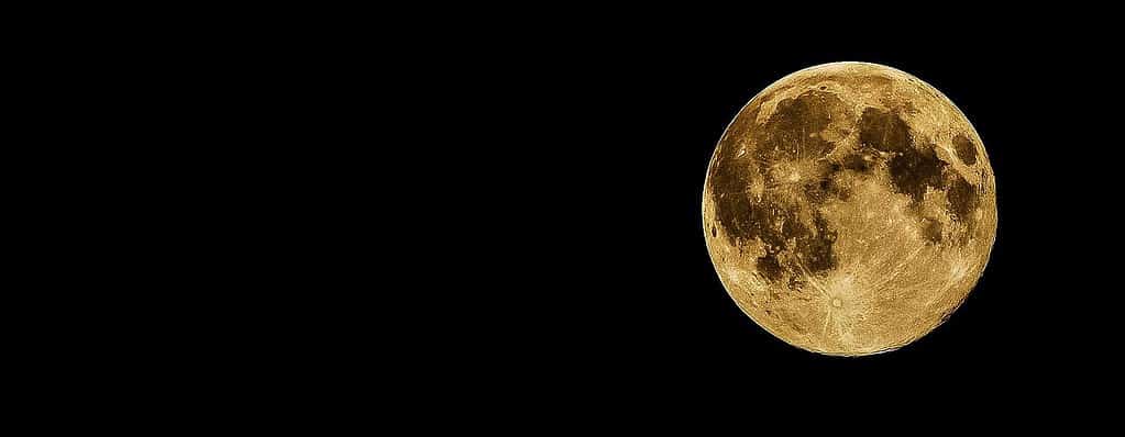 a photo of the moon on a black night