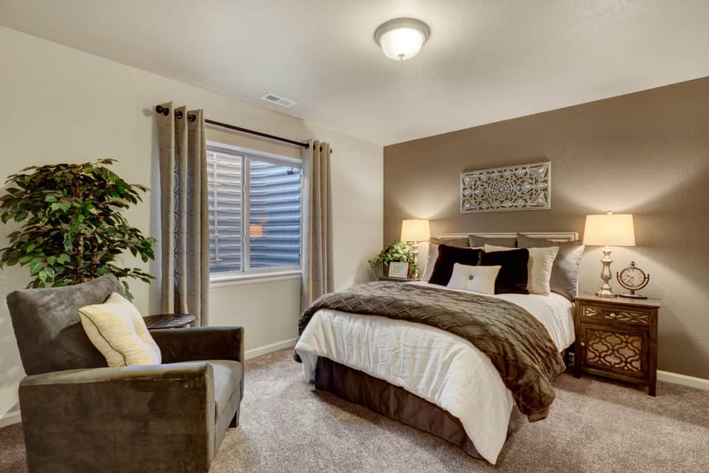 Photo of a brown taupe and white bedroom