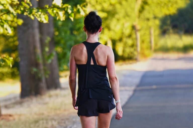 A girl walking down the street showing healthy hacks